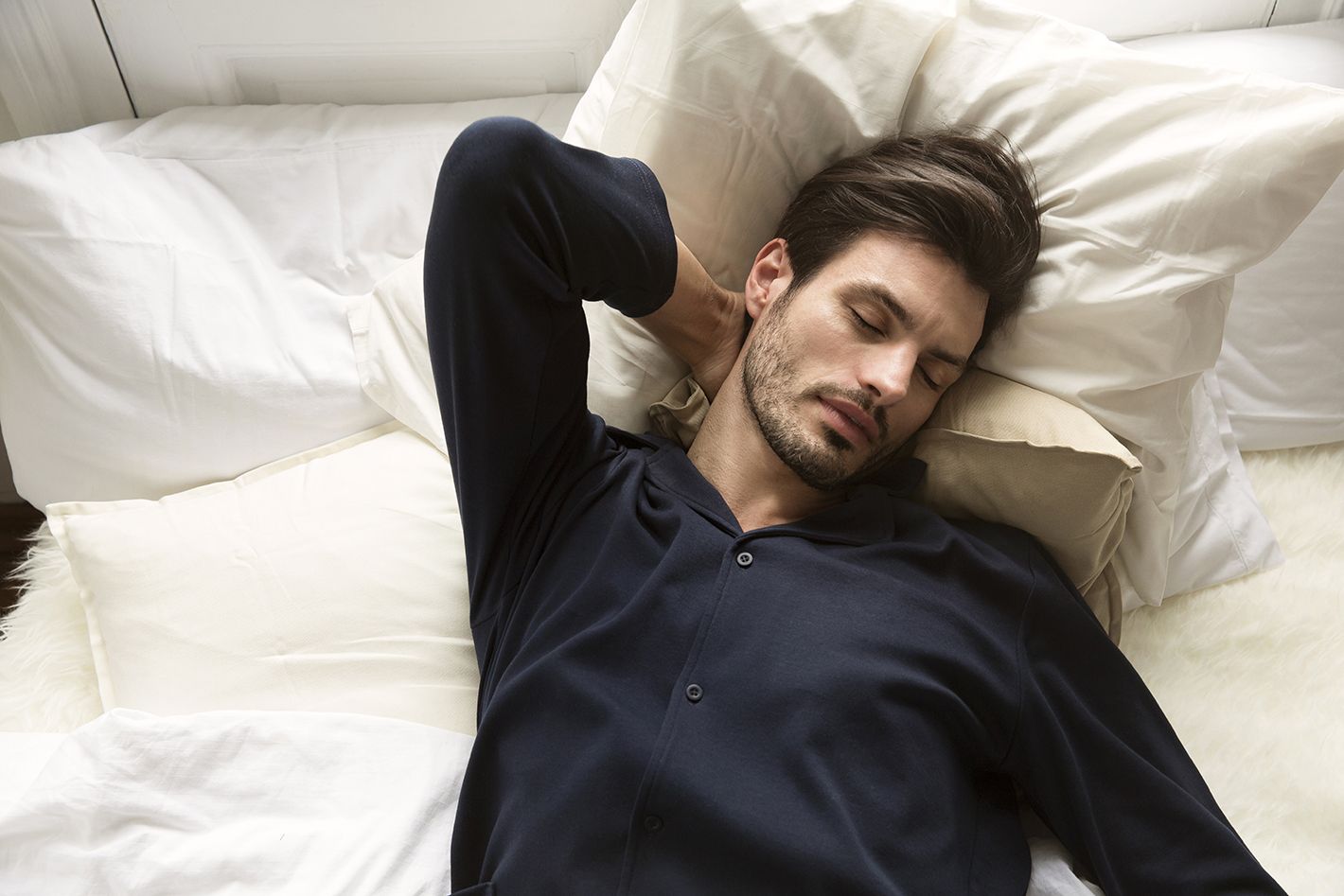 man with pyjamas sleeping